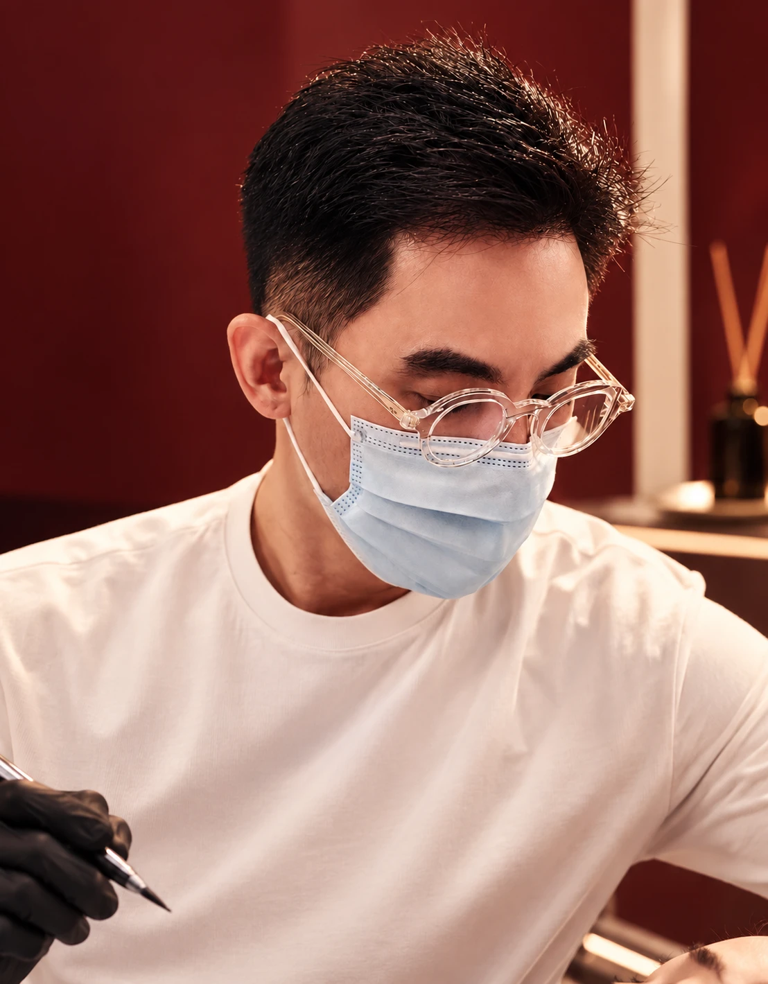 Sam Liang, founder of Sambrow, working with a client in the Markham studio